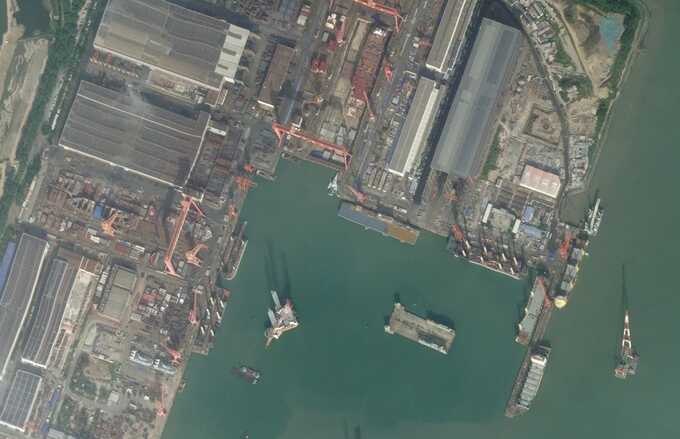 This satellite image captured on October 23, 2024, shows an entirely new class of Chinese vessel with a large open flight deck at a shipyard in the southeastern end of the country. Planet Labs PBC