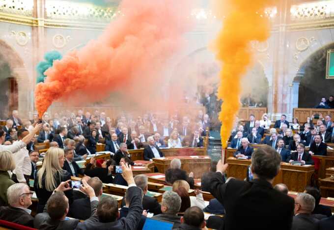Opposition MPs set off flares in the Hungarian parliament. Photograph: Boglárka Bodnár/AP