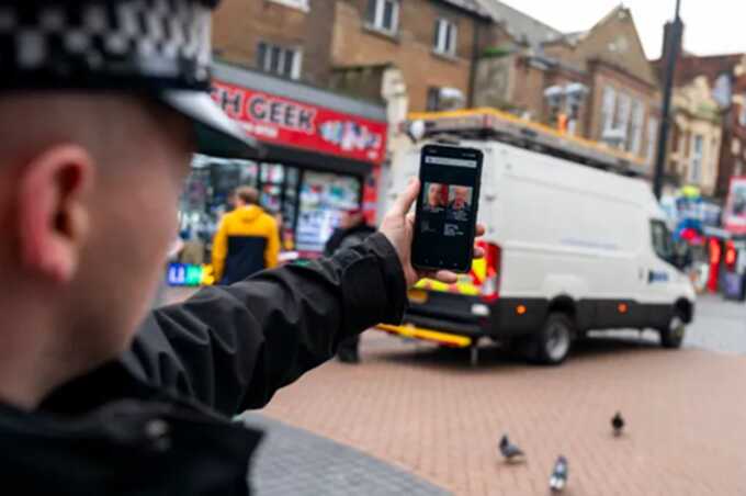 A Metropolitan Police officer demonstrates the smart phone application used by the Met’s live facial recognition technology in Croydon, south London (Picture: PA)