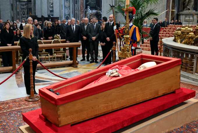 The Italian prime minister, Giorgia Meloni, paying her respects to Pope Francis inside St Peter’s Basilica. Photograph: Vatican Media Handout/EPA