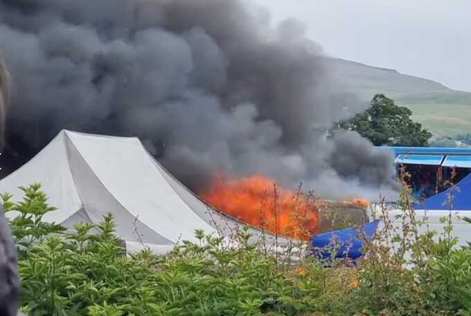 Explosion and smoke at giant Gypsy fair in Cumbria: fire engulfs fairground village