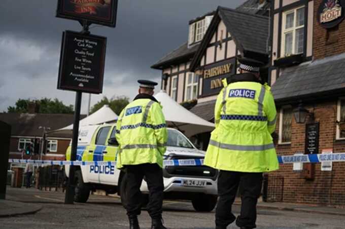A police cordon is also around the nearby Fairway Inn (Picture: JMP Press)