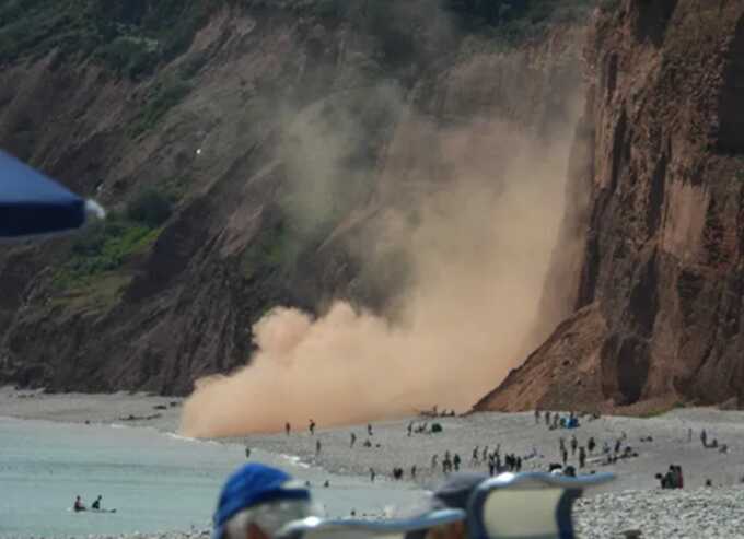 Sunbathers were frighteningly close to the massive rock fall in Devon (Picture: Jam Press/James Walters)