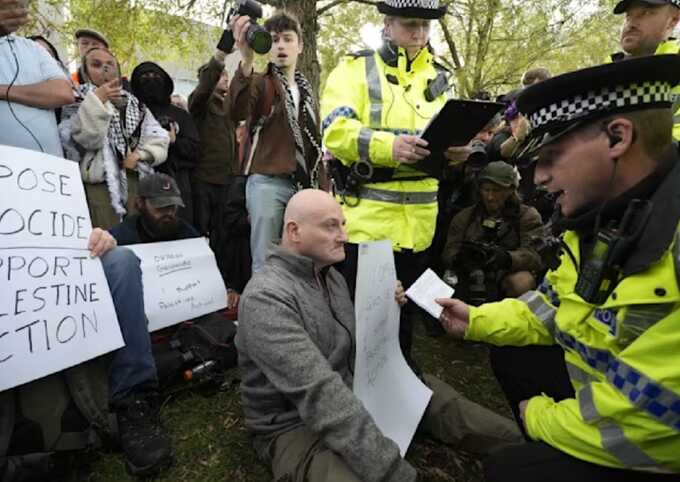 Police arrest protesters outside Labour party conference in Liverpool