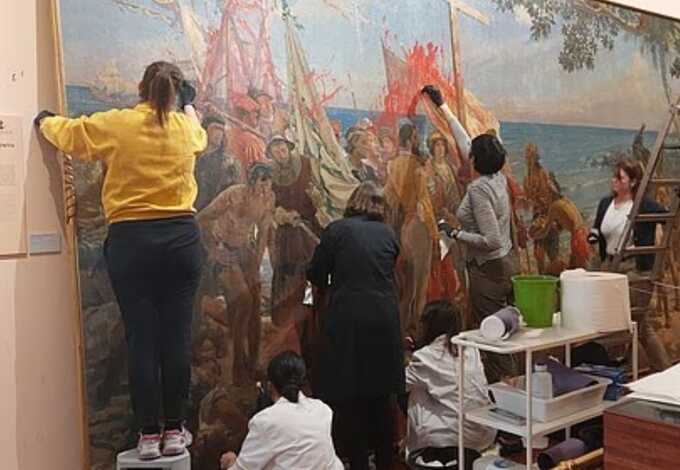 Climate activists throw red paint over 133-year-old Christopher Columbus painting in Madrid museum