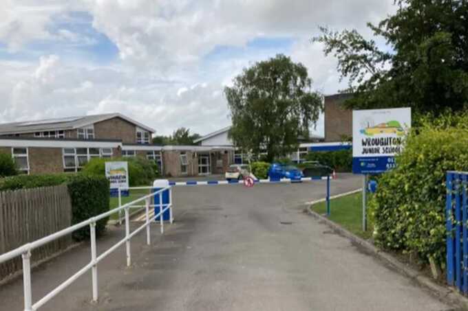 Police release CCTV of man with air rifle after chaos outside primary school