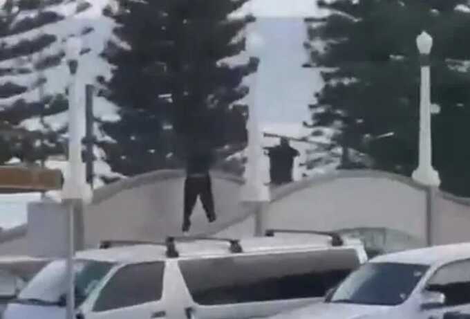 Unverified footage shared on X appears to show two people holding firearms (Picture: X)