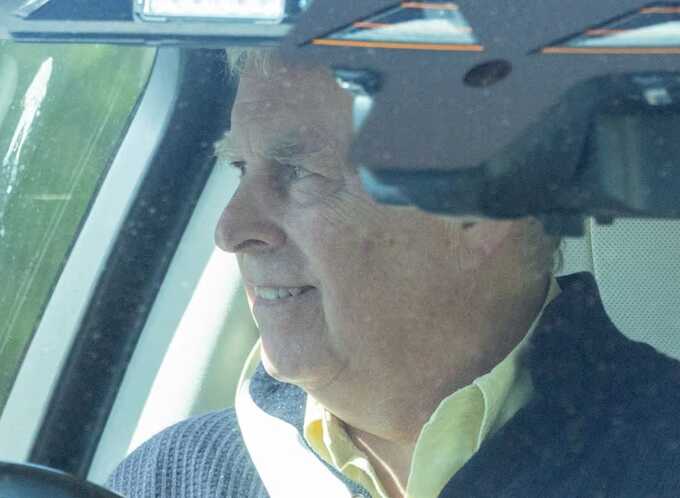 Disgraced Andrew seen driving and smiling as royal exile continues at Sandringham