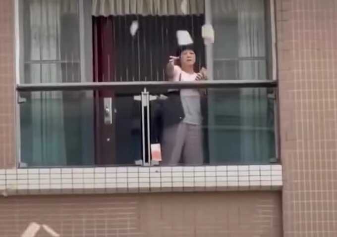 Woman throws $162,000 from balcony in China as police launch investigation