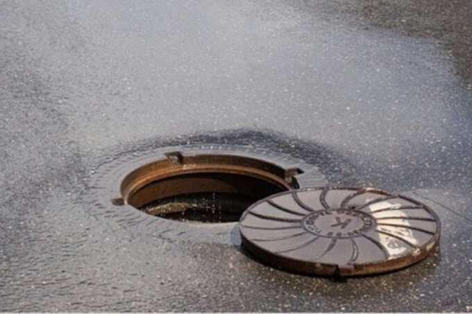 Woman plunges into open manhole after alleged thieves loosen cover hours earlier