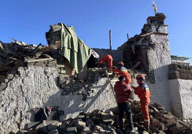 In this photo released by Xinhua News Agency, rescue workers search for survivors in the aftermath of an earthquake in Changsuo Township of Dingri in Xigaze, southwestern China&rsquo;s Tibet Autonomous Region on Tuesday, Jan. 7, 2025. (Xinhua via AP)