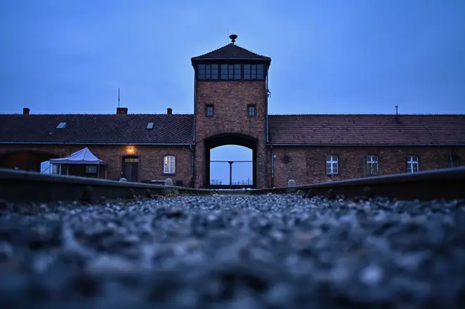 A view of the main entrance and train track at the former Nazi death camp Auschwitz Birkenau dqxikeidqkikdinv