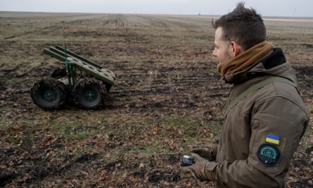 A Ukrainian serviceman operates a mine-laying unmanned ground vehicle in the Kharkiv region dqxikeidqkikdinv