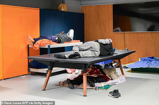 &nbsp;Pictures from inside the theatre show people sleeping on tables in cramped conditions