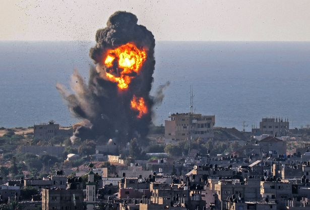 Smoke billows from an explosion following an Israeli air strike in Rafah in the southern Gaza Strip
