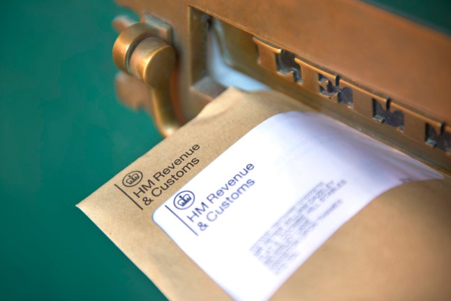 LONDON, UNITED KINGDOM - APRIL 01: Photograph shows a front door letter box with HMRC envelope, Her Majestys Revenue and Customs (HMRC) reminding of the date that self-assessment tax returns need to be completed by self-employed companies and individuals on April 01, 2022 in London, England.(Photo by Peter Dazeley/Getty Images) dqxikeidqkikdinv