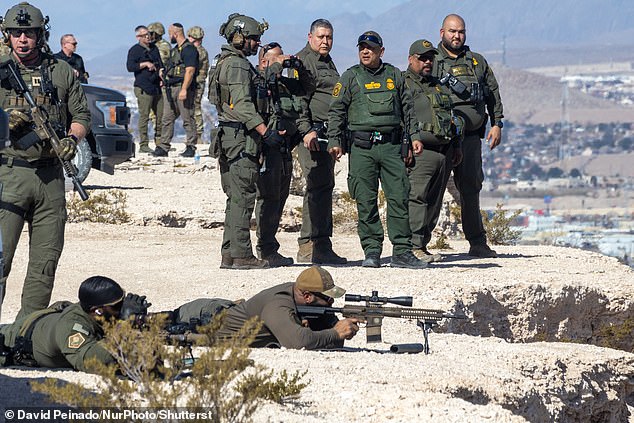 US law enforcement agents stationed at the US-Mexico border were warned this week about possible attacks from Mexican drug cartels using kamikaze drones with explosives (Pictured: Various officers monitor at the El Paso border crossing in Texas on February 3) dqxikeidqkikdinv