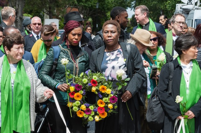 LONDON, UNITED KINGDOM - JUNE 14: Survivors, bereaved families, members of the public and community leaders gather outside St. Helen’s Church in London to take part in the ’Humanity for Grenfell’ commemorations on 14 June, 2019, marking the second anniversary of the Grenfell Tower fire, which took the lives of 72 people two years ago. (Photo credit should read Wiktor Szymanowicz/Future Publishing via Getty Images) dqxikeidqkikdinv