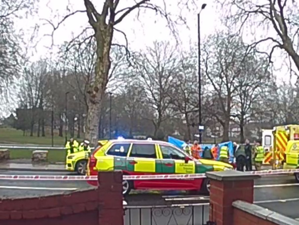 Emergency responders at the scene of a car and bus accident. dqxikeidqkikdinv