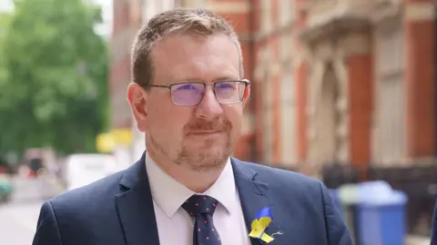 PA Media File photo dated 09/06/22 of Labour MP Andrew Gwynne walking dqxikeidqkikdinv