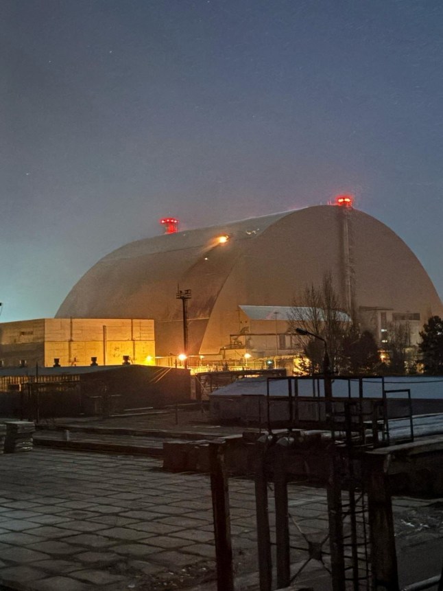 Fire burns on the structure that covers the old sarcophagus which confines the remains of the damaged fourth reactor of the Chornobyl Nuclear Power Plant, after it was hit by what the Ukrainian President Volodymyr Zelenskiy says a Russian drone strike, amid Russia&rsquo;s attack on Ukraine, at Chornobyl, in Kyiv region, Ukraine February 14, 2025. IAEA/Handout via REUTERS ATTENTION EDITORS - THIS IMAGE HAS BEEN SUPPLIED BY A THIRD PARTY.