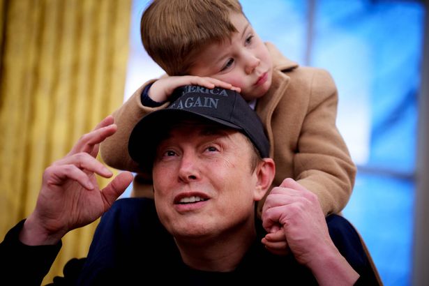 X Musk sits on the shoulders of his father, Tesla and SpaceX CEO Elon Musk, as they join U.S. President Donald Trump for an executive order signing in the Oval Office at the White House on February 11, 2025 dqxikeidqkikdinv