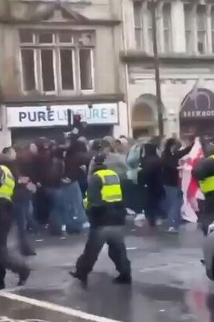 a mob walking through cardiff dqxikeidqkikdinv