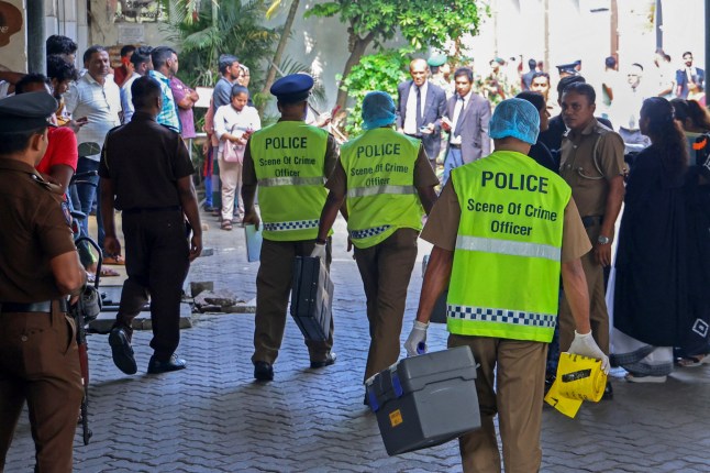 Policemen arrive at the chief magistrate’s court in Colombo on February 19, 2025. A Sri Lankan man accused of being a top drug dealer was shot dead inside a courthouse on February 19 by a gunman disguised as a lawyer, police said. Ganemulle Sanjeeva was shot at close range as he entered the dock in a bail hearing at the Colombo Magistrates Court, police said in a statement. (Photo by AFP) (Photo by -/AFP via Getty Images) dqxikeidqkikdinv