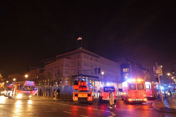 Ambulances park in front of the US Embassy near the crime scene dqxikeidqkikdinv