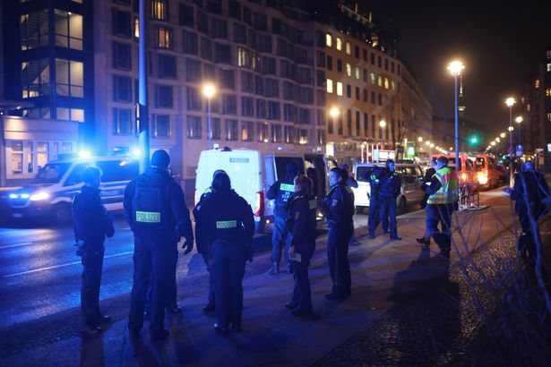 Multiple police officers at the scene in Mitte, Berlin