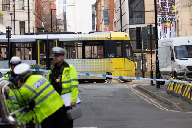 Manchester tram crash scene with police tape. dqxikeidqkikdinv