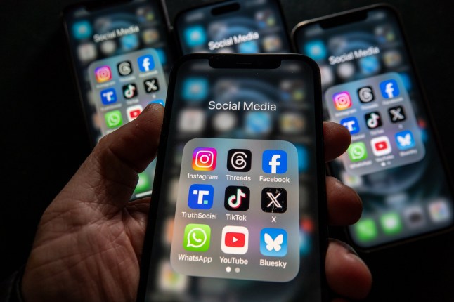 BATH, UNITED KINGDOM - FEBRUARY 09: In this photo illustration, iPhone screens display various social media apps on the screens on February 9, 2025 in Bath, England. On top row left to right, the logo of social media platform Instagram is seen beside that of Meta???s Threads and Facebook. On the middle row from left is the logo of Donald Trump’s Truth Social app, next to the logo of social media app TikTok and the logo of Elon Musk???s US online social media and social networking site ’X’ (formerly known as Twitter). Along the bottom row, left to right is the messaging service WhatsApp, the logo for online video sharing and social media platform YouTube and the logo for the Bluesky app. Recently the Australian Senate passed a law to ban children under 16 from having social media accounts and social media platforms, including TikTok, Facebook, Snapchat, Reddit, X, formerly Twitter, and Instagram potentially being be fined for preventing children younger than 16 from having social media accounts. (Photo by Anna Barclay/Getty Images) dqxikeidqkikdinv