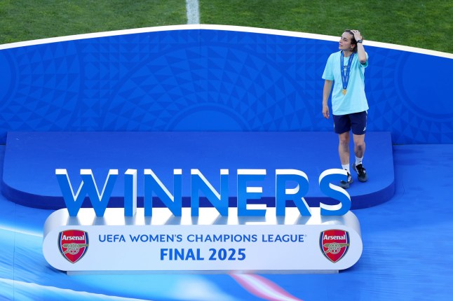 LISBON, PORTUGAL - MAY 24: Renee Slegers, Manager of Arsenal, looks on as she walks onto the Winners Stage after collecting her winners medal after defeating FC Barcelona during the UEFA Women’s Champions League final match between Arsenal WFC and FC Barcelona at Estadio Jose Alvalade on May 24, 2025 in Lisbon, Portugal. (Photo by Molly Darlington - UEFA/UEFA via Getty Images)